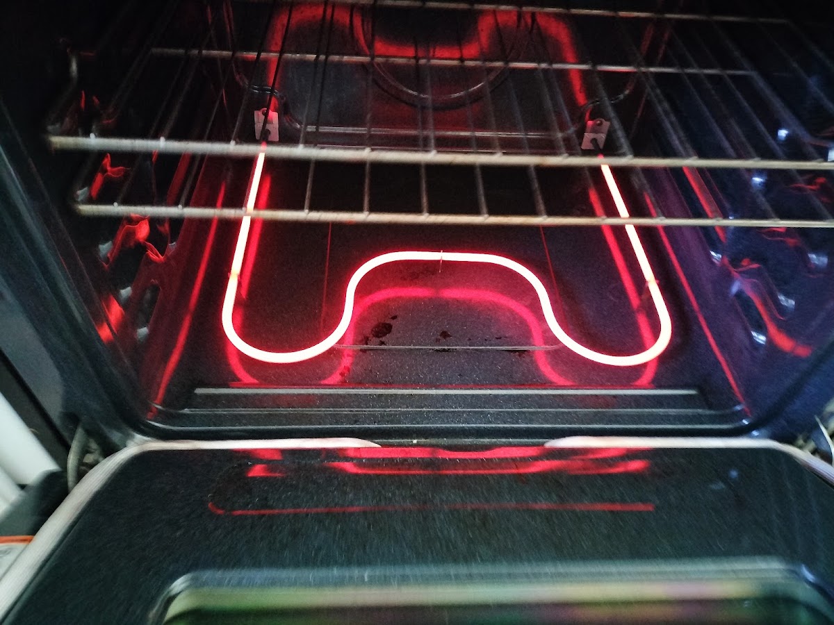 A glowing oven heating element, a part we keep on the shelf
